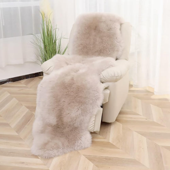 Linen 2x6 ft genuine sheepskin runner draped over a cream armchair